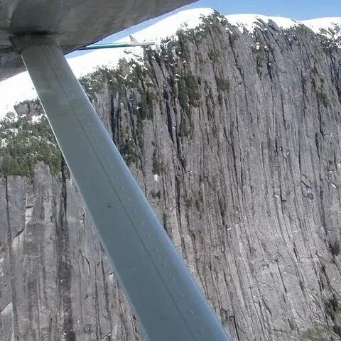 A granite wall beyond the wing